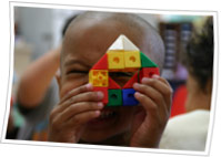 Young child playing with toy blocks..
